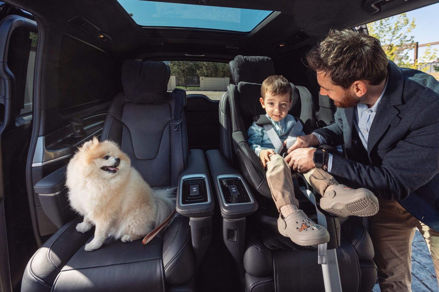 Family and pet in luxury vehicle